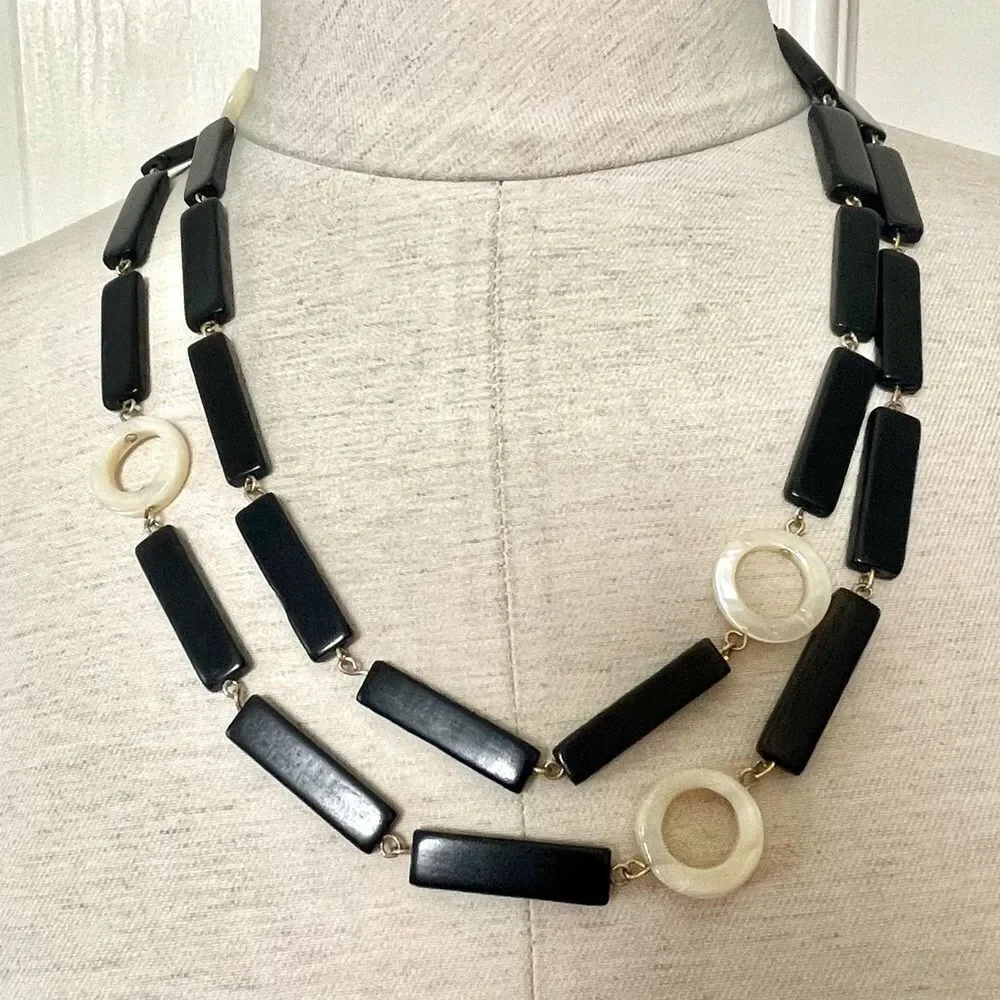 Long black beaded necklace with cream circle beads